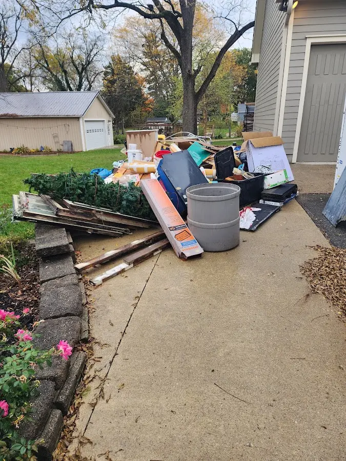Dumpster being loaded with debris for Commercial Dumpster Rental in Palos Heights